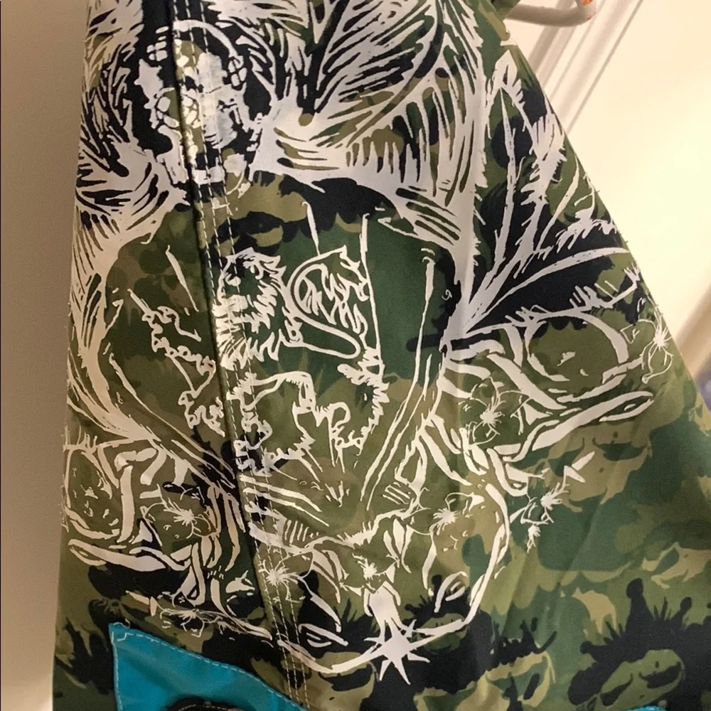 Live Mechanics Green/Blue Board Shorts with Drawstring Waist Camo Lion design.